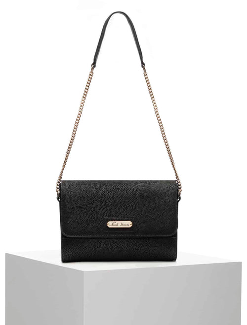 Alt="The bag is adorned with a gold 'Nicole Serrano' logo plate, adding a touch of luxury. Perfect for evening wear or stylish daily use, enhancing any outfit with its timeless design, available only at Pink Maison."